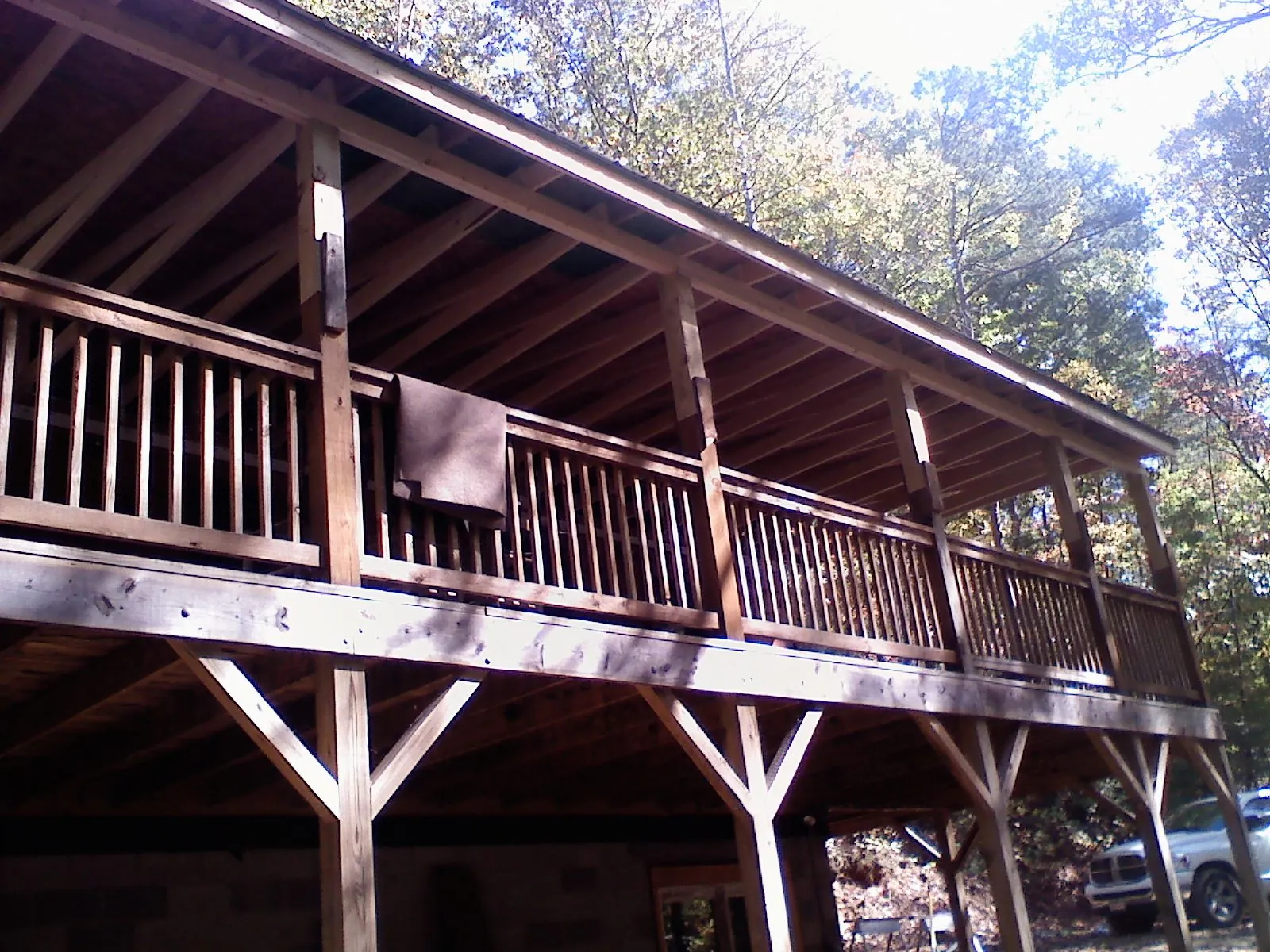 Timber framing under a new elevated porch and deck — Roof Leak Repair in Monclova by Roofing Brothers